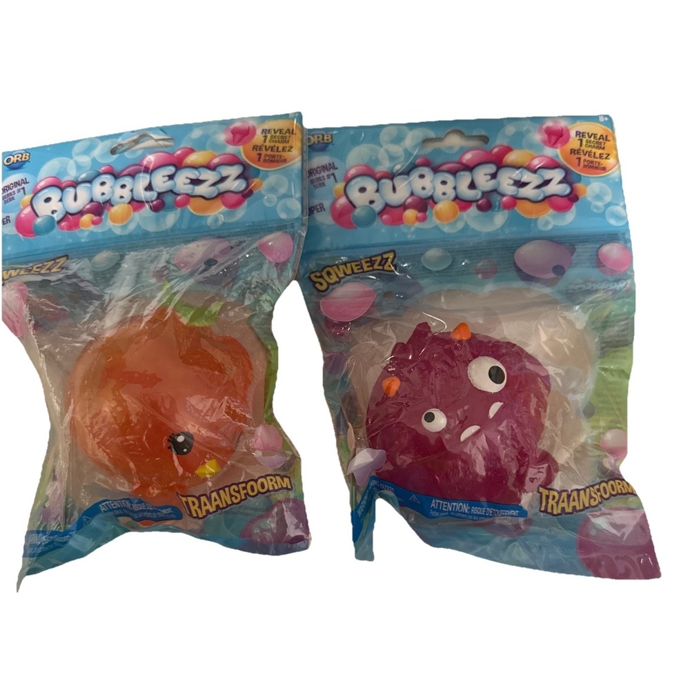 2 orb Super BUBBLEEZZ SQUWEEZZ collectable stress ball 1 secret charm In each.